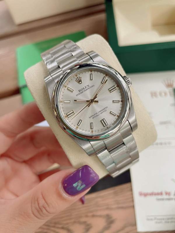 Rolex Oyster Perpetual With silver sunburst dial