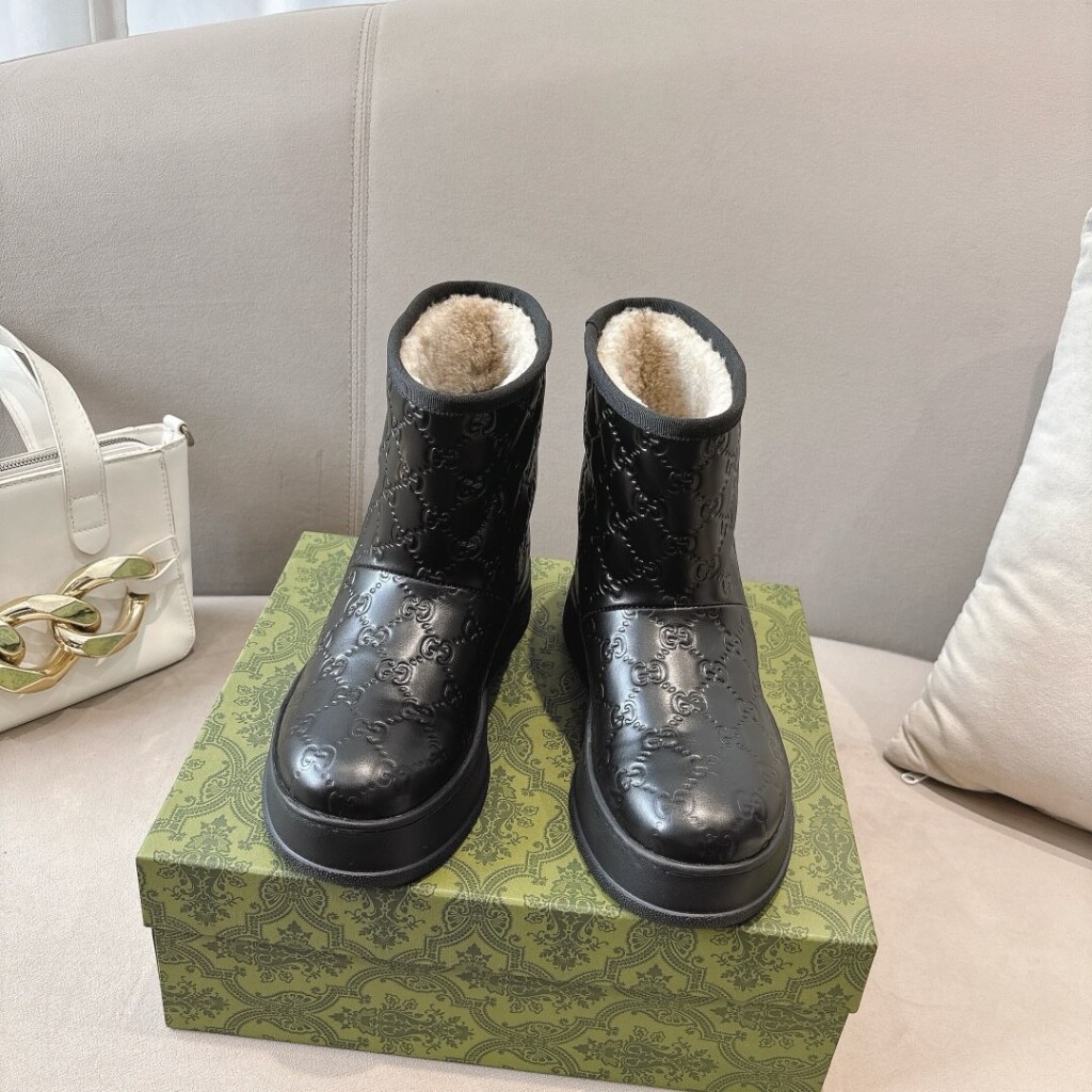 Gucci Women's Black GG Embossed Leather Boot