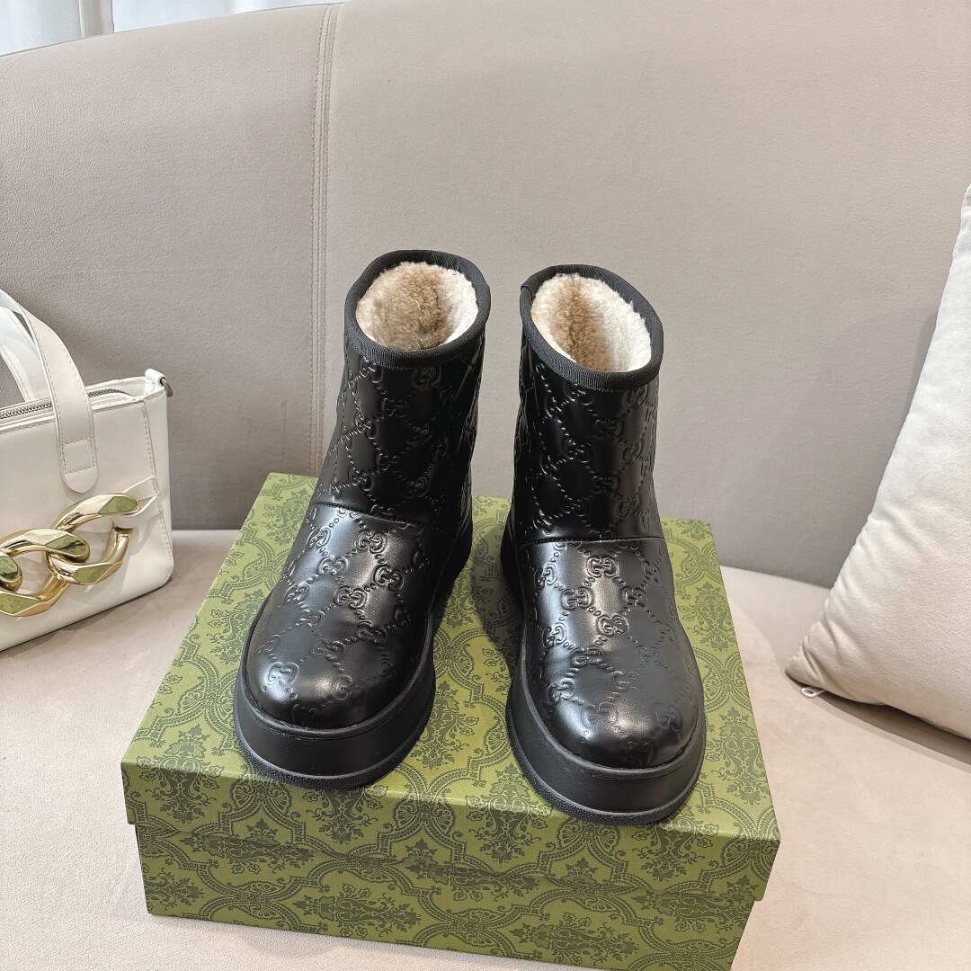 Gucci Women's Black GG Embossed Leather Boot