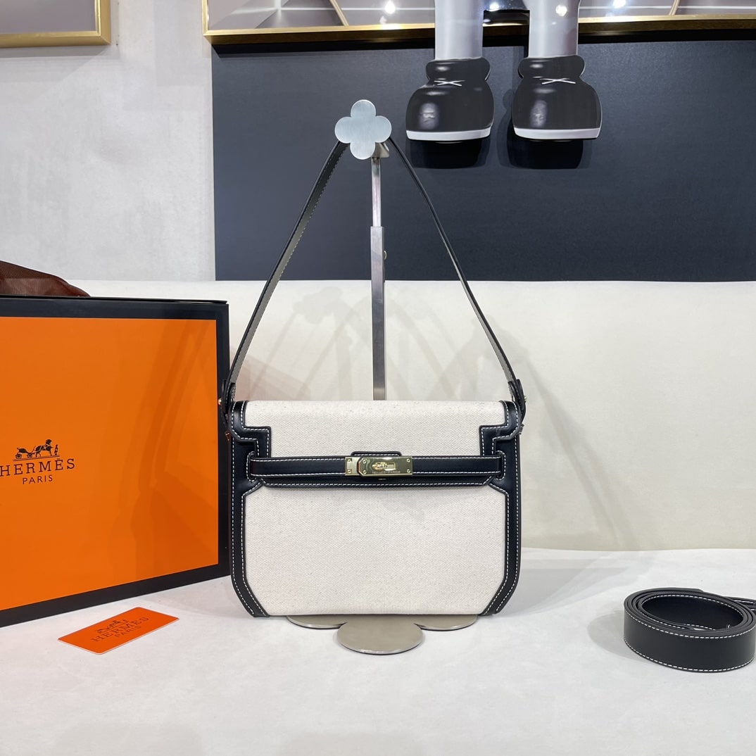 Hermès Kelly Depeches 25cm White and Black Bag