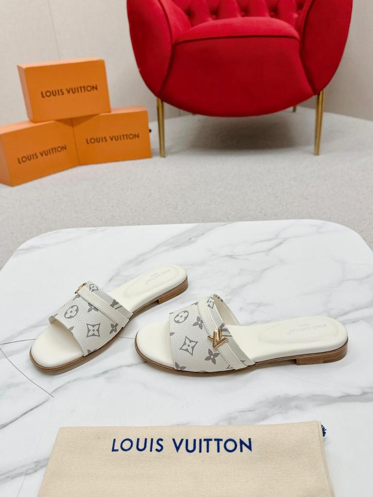 Louis Vuitton Lock It Flat Mules in Monogram Empreinte Leather