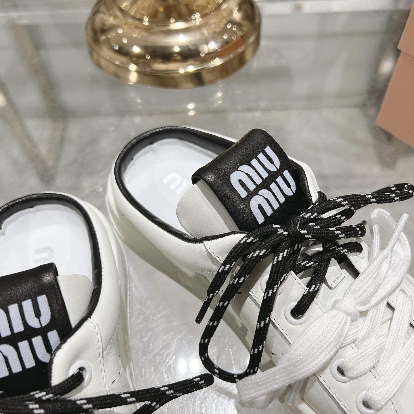 Miu Miu Double Lace Slip-On Sneakers in White with Black Accents - Image 9