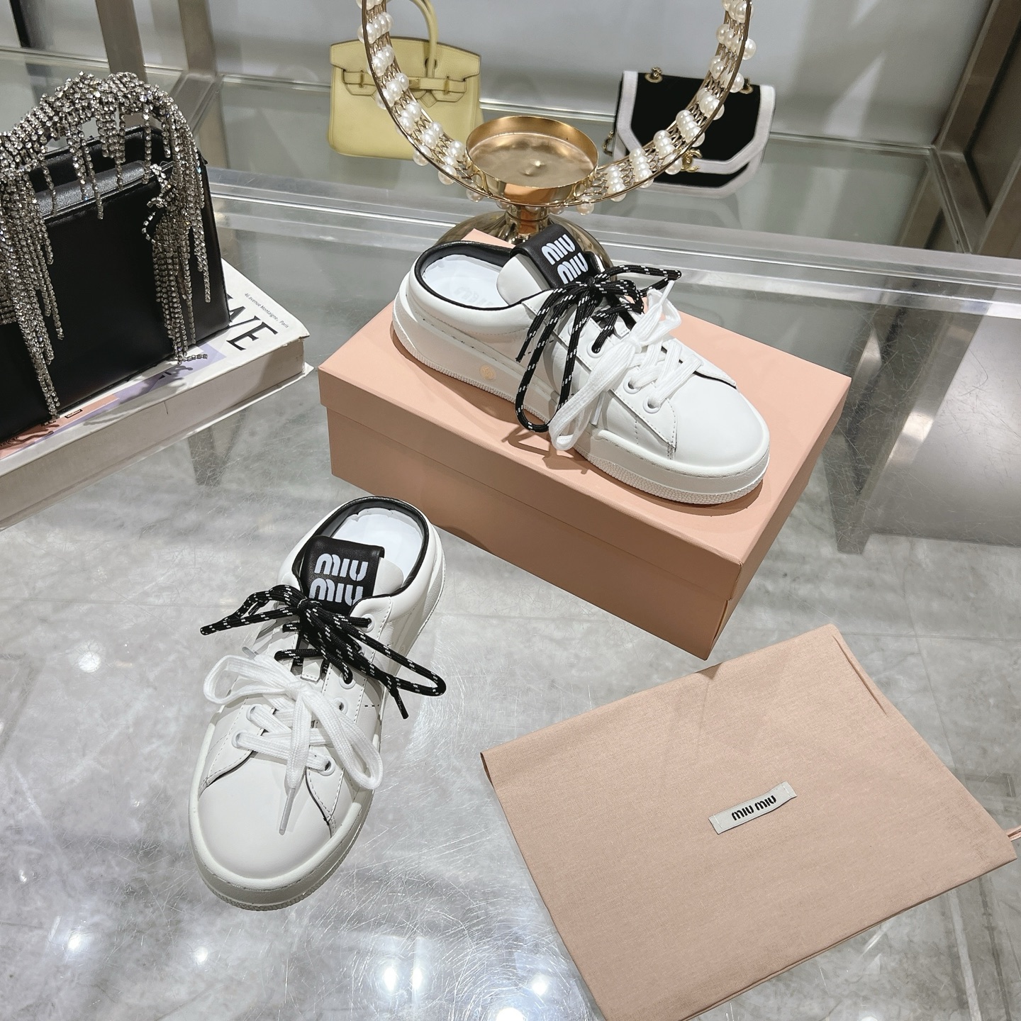 Miu Miu Double Lace Slip-On Sneakers in White with Black Accents