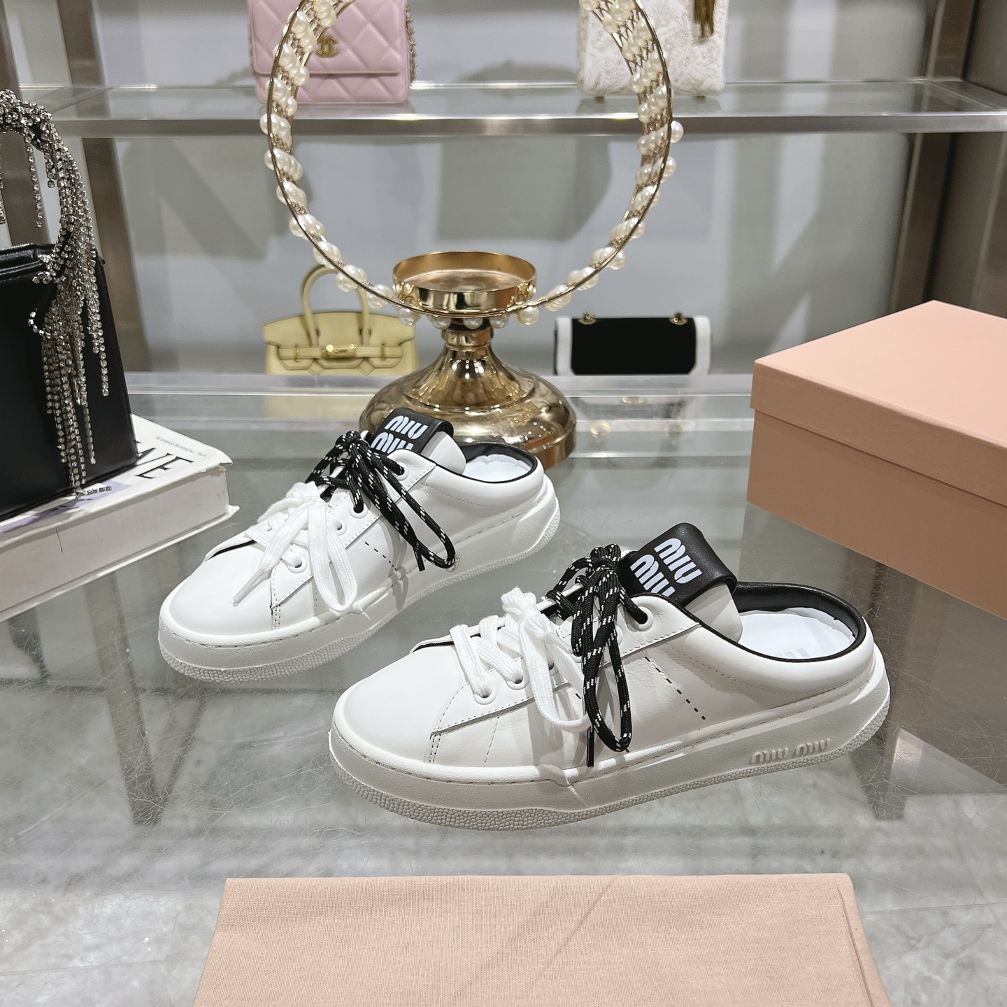 Miu Miu Double Lace Slip-On Sneakers in White with Black Accents - Image 4