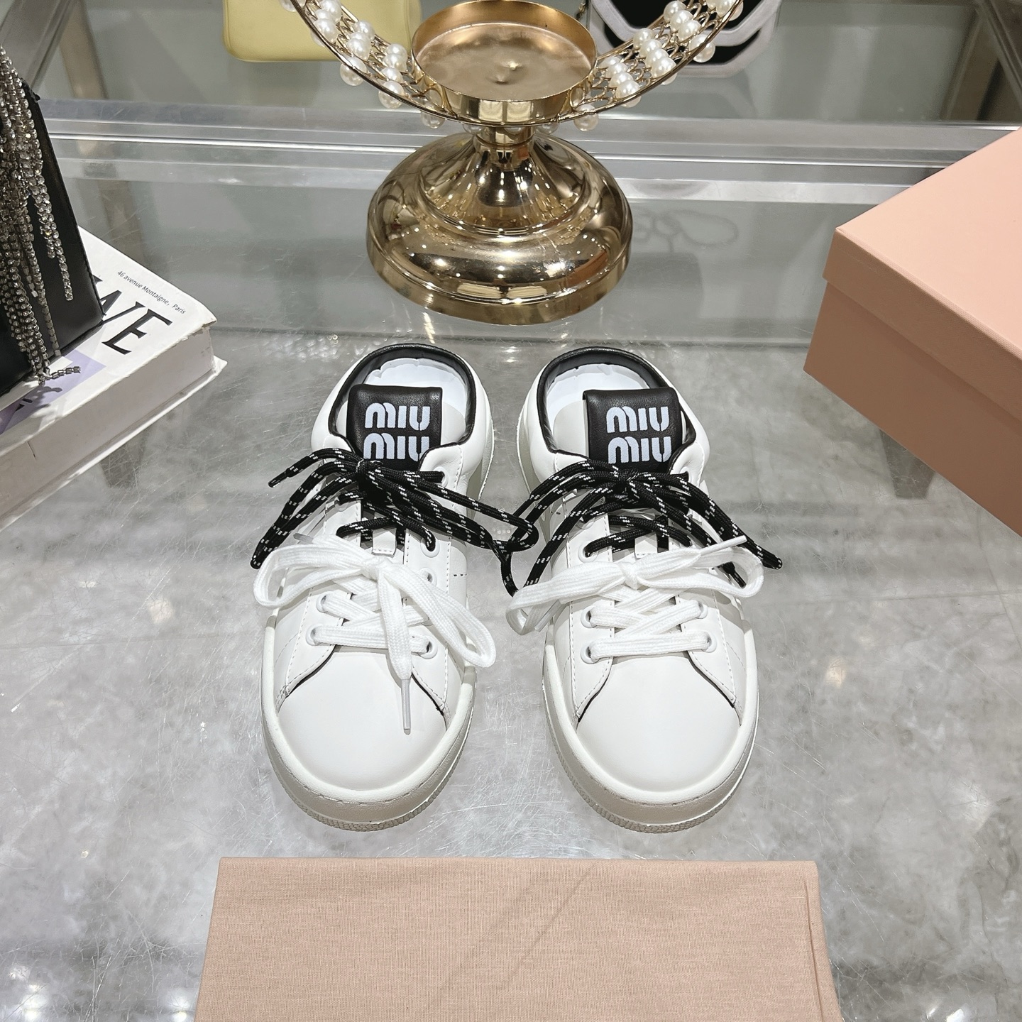 Miu Miu Double Lace Slip-On Sneakers in White with Black Accents - Image 2