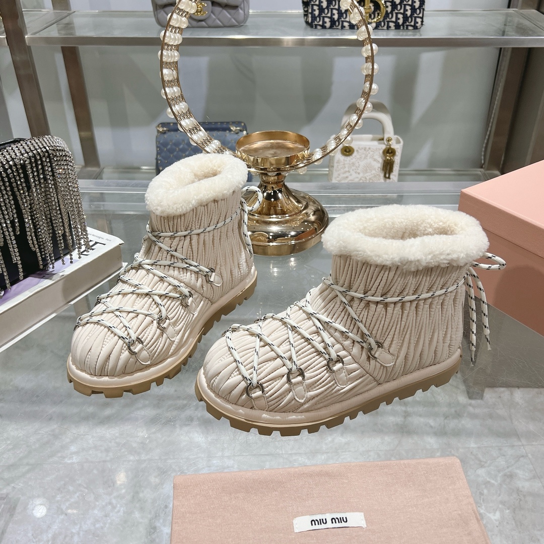 Miu Miu Ivory shearling après-ski boots