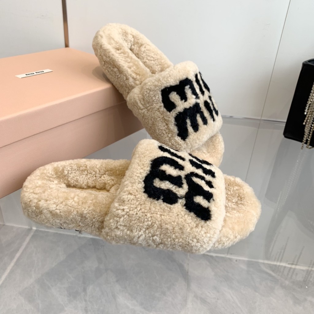Miu Miu Beige Shearling Slippers with Black Logo