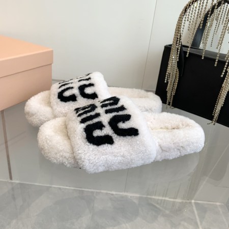 Miu Miu White Shearling Slippers with Black Logo