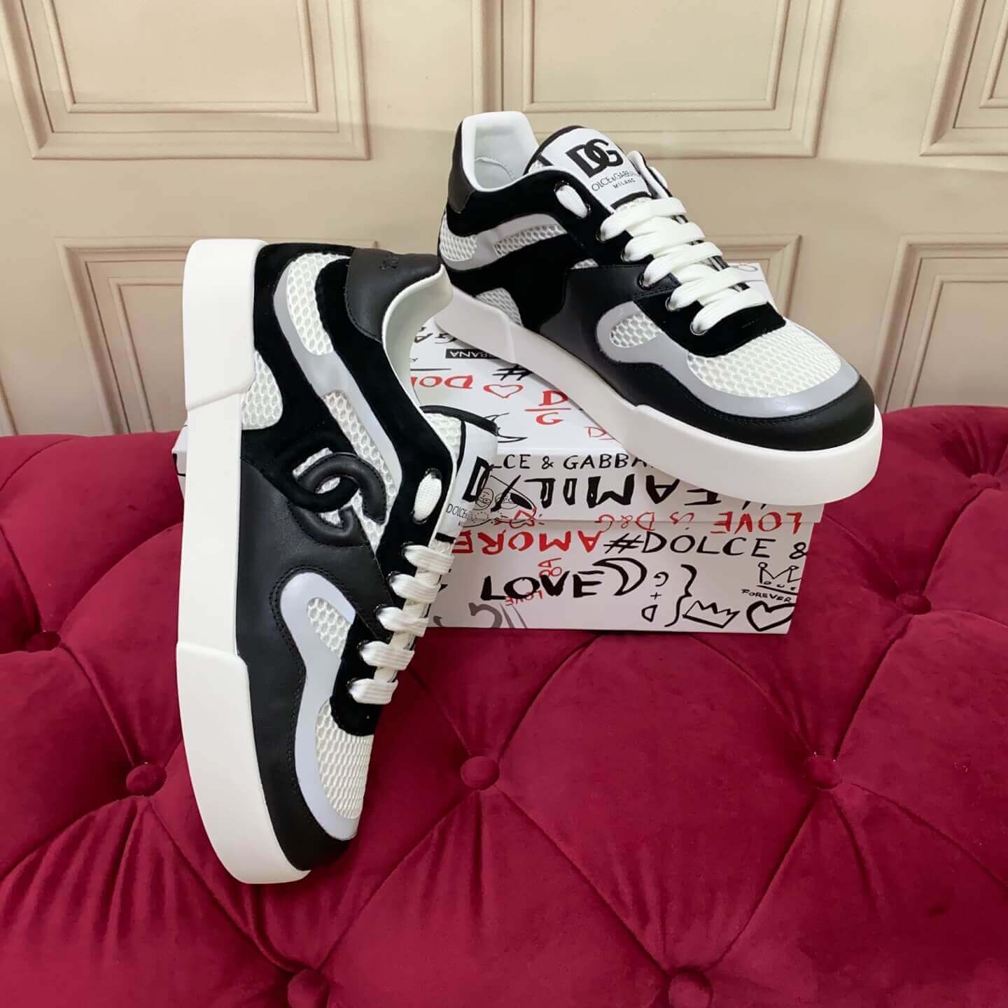 Dolce & Gabbana Men's/Unisex Calfskin Strobel Portofino Light low-Top Sneakers - Black, Grey & White with bold DG logo detailing.
