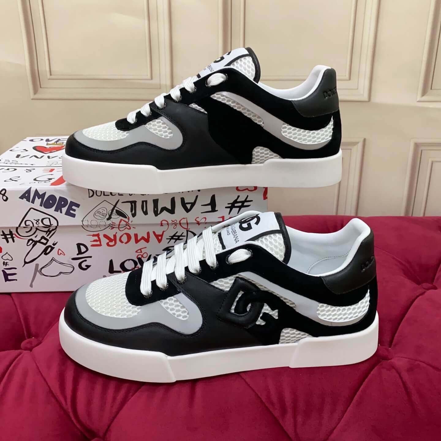 Dolce & Gabbana Men's/Unisex Calfskin Strobel Portofino Light low-Top Sneakers - Black, Grey & White with bold DG logo detailing.