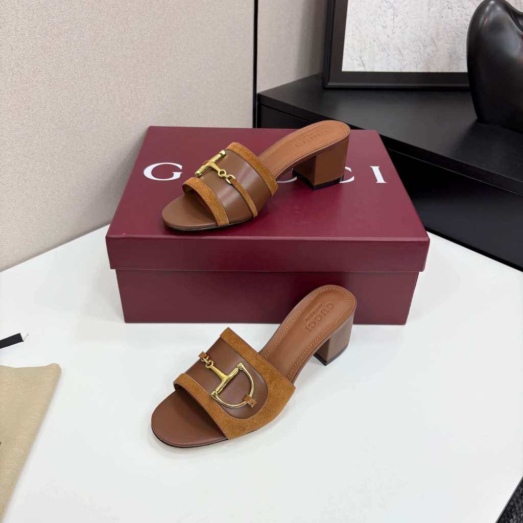 a pair of Gucci Women's Brown Suede Block Heel Slide Sandals with Horsebit and GG Monogram Canvas