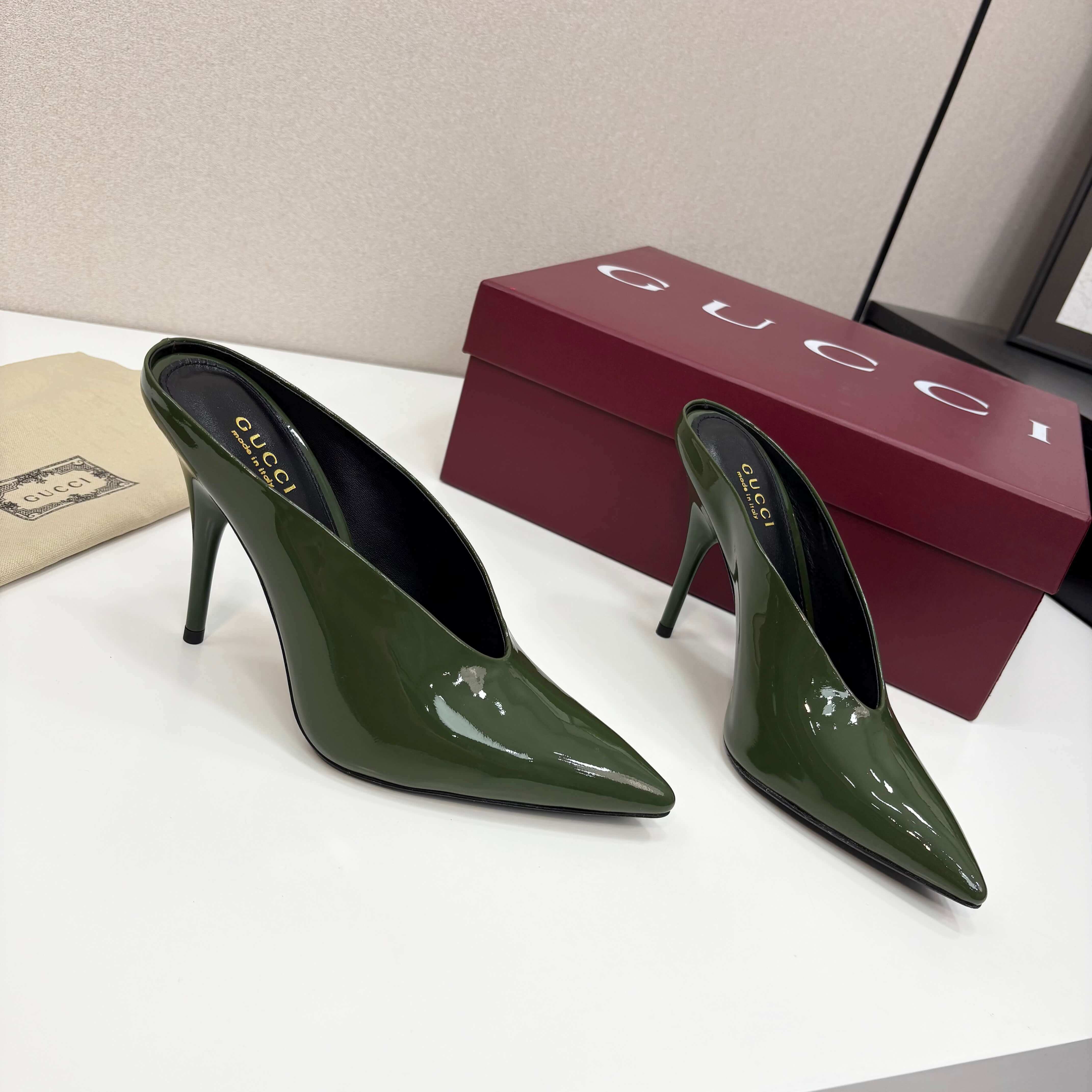 a pair of Gucci Women's Green Shiny Patent Leather Slingback Pumps with Pointed Toe and Thin Hee
