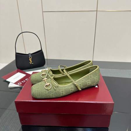 a pair of Gucci Women's Horsebit Ballet Flat - Green Original GG Canvas on a box