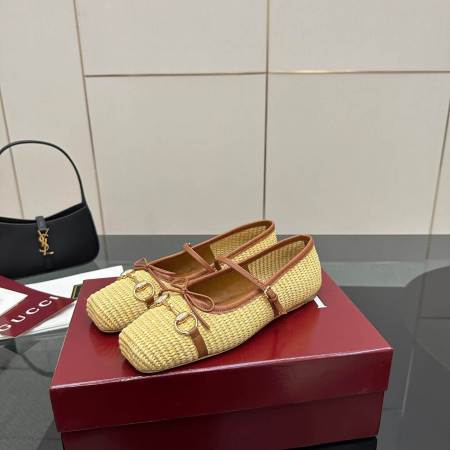 a pair of Gucci Women's Horsebit Ballet Flat - Natural Raffia on a box