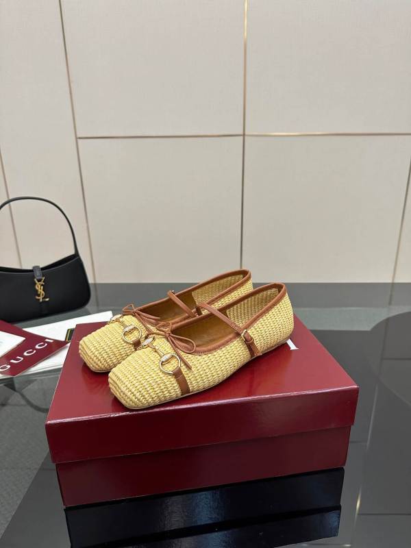 a pair of Gucci Women's Horsebit Ballet Flat - Natural Raffia on a box