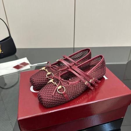 a pair of Gucci Women's Horsebit Ballet Flat - Rosso Ancora Red Mesh on a box