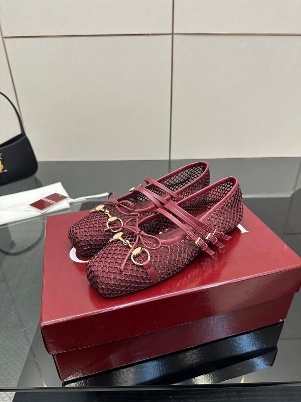 a pair of Gucci Women's Horsebit Ballet Flat - Rosso Ancora Red Mesh on a box