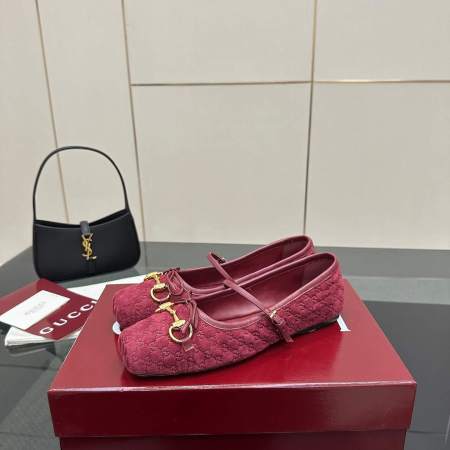 a pair of Gucci Women's Horsebit Ballet Flat - Rosso Ancora Red Original GG Canvas on a box