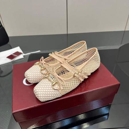 a pair of Gucci Women's Horsebit Ballet Flat in Beige Mesh. on a box