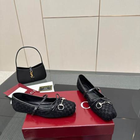 a pair of Gucci Women's Horsebit Ballet Flat in Black Original GG Canvas on a box