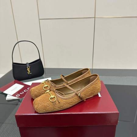 a pair of Gucci Women's Horsebit Ballet Flat in Brown Original GG Canvas on a box