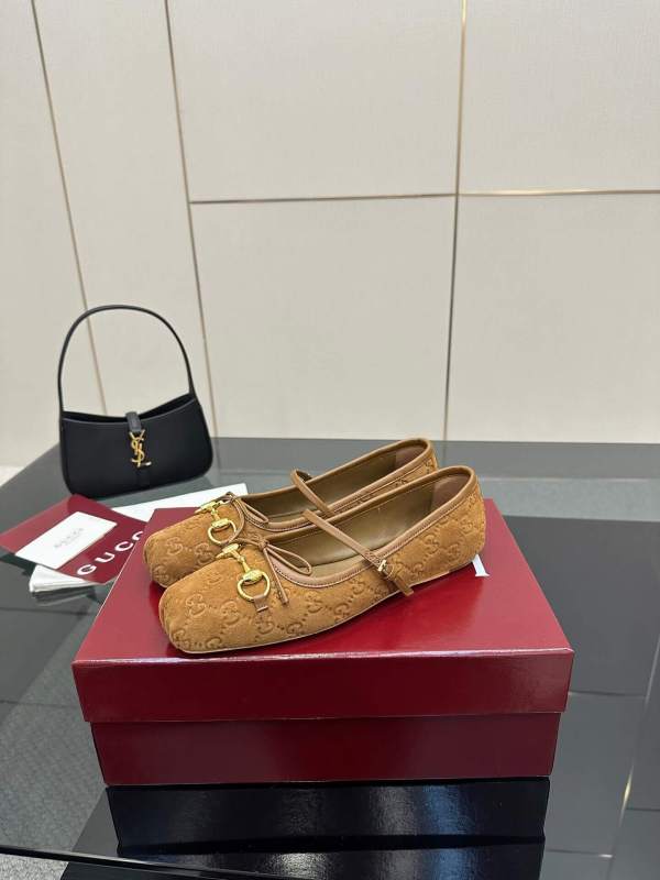 a pair of Gucci Women's Horsebit Ballet Flat in Brown Original GG Canvas on a box
