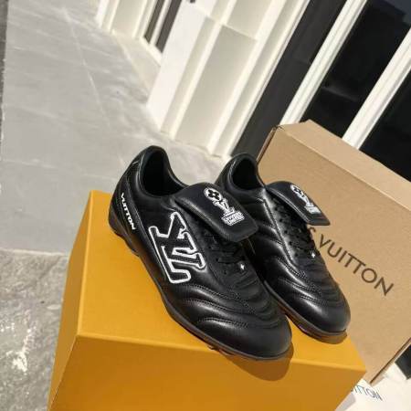 a pair of LV Footprint Soccer Sneakers – Bold Style, Game-Ready Vibe on a box