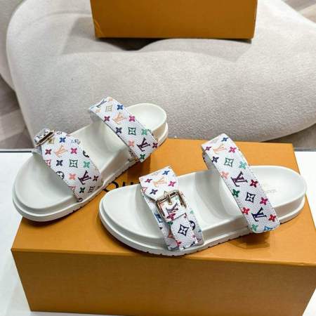 a pair of LV x TM Bom Dia Flat Comfort Mule – Inspired by Louis Vuitton on a box