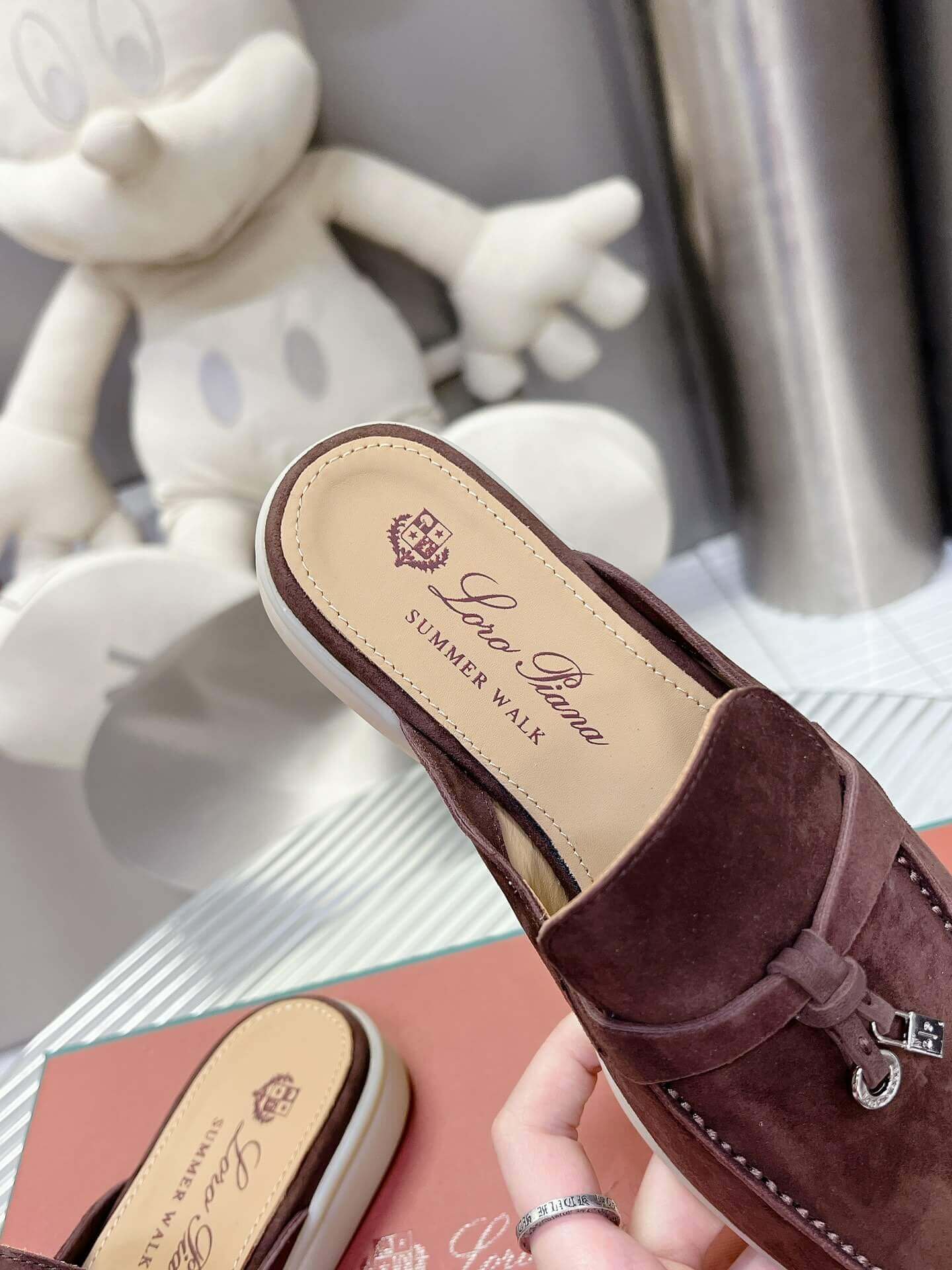 Loro Piana Men's/Unisex Babouche Charms Walk Loafers in Dark Brown Suede, displayed on a box.