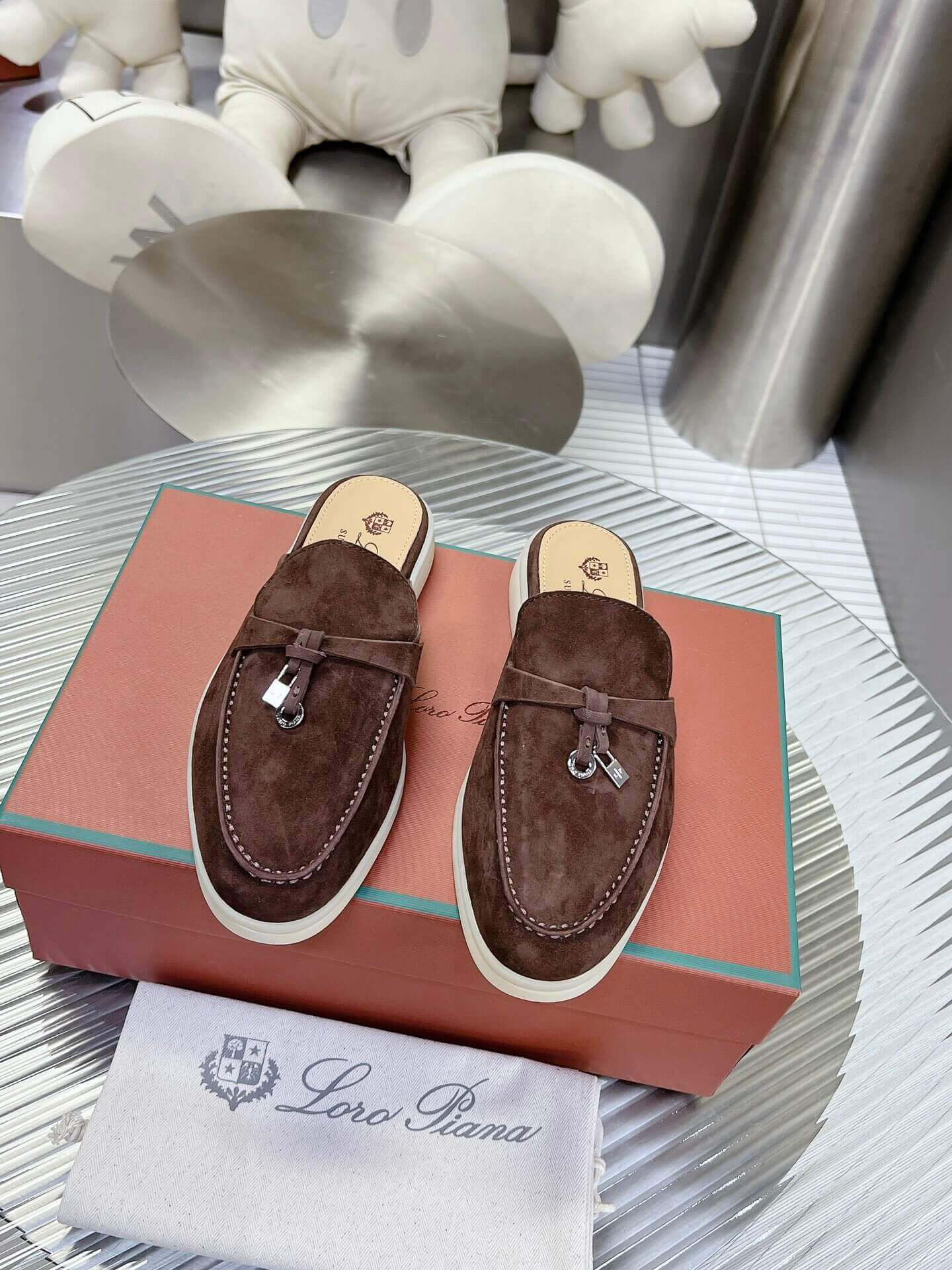 Loro Piana Men's/Unisex Babouche Charms Walk Loafers in Dark Brown Suede, displayed on a box.