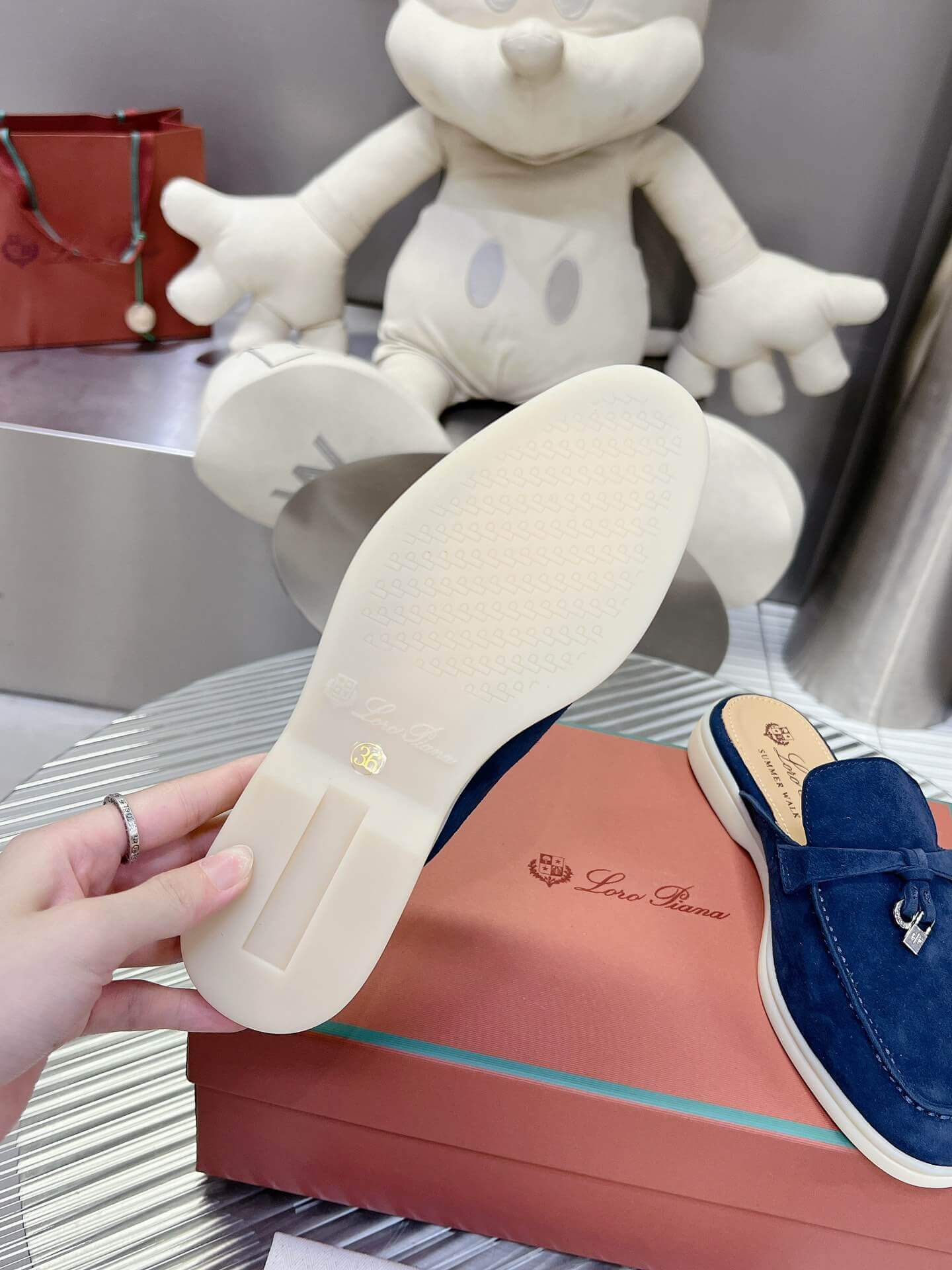 Loro Piana Men's/Unisex Babouche Charms Walk Loafers in Navy Blue Suede, displayed on a box.