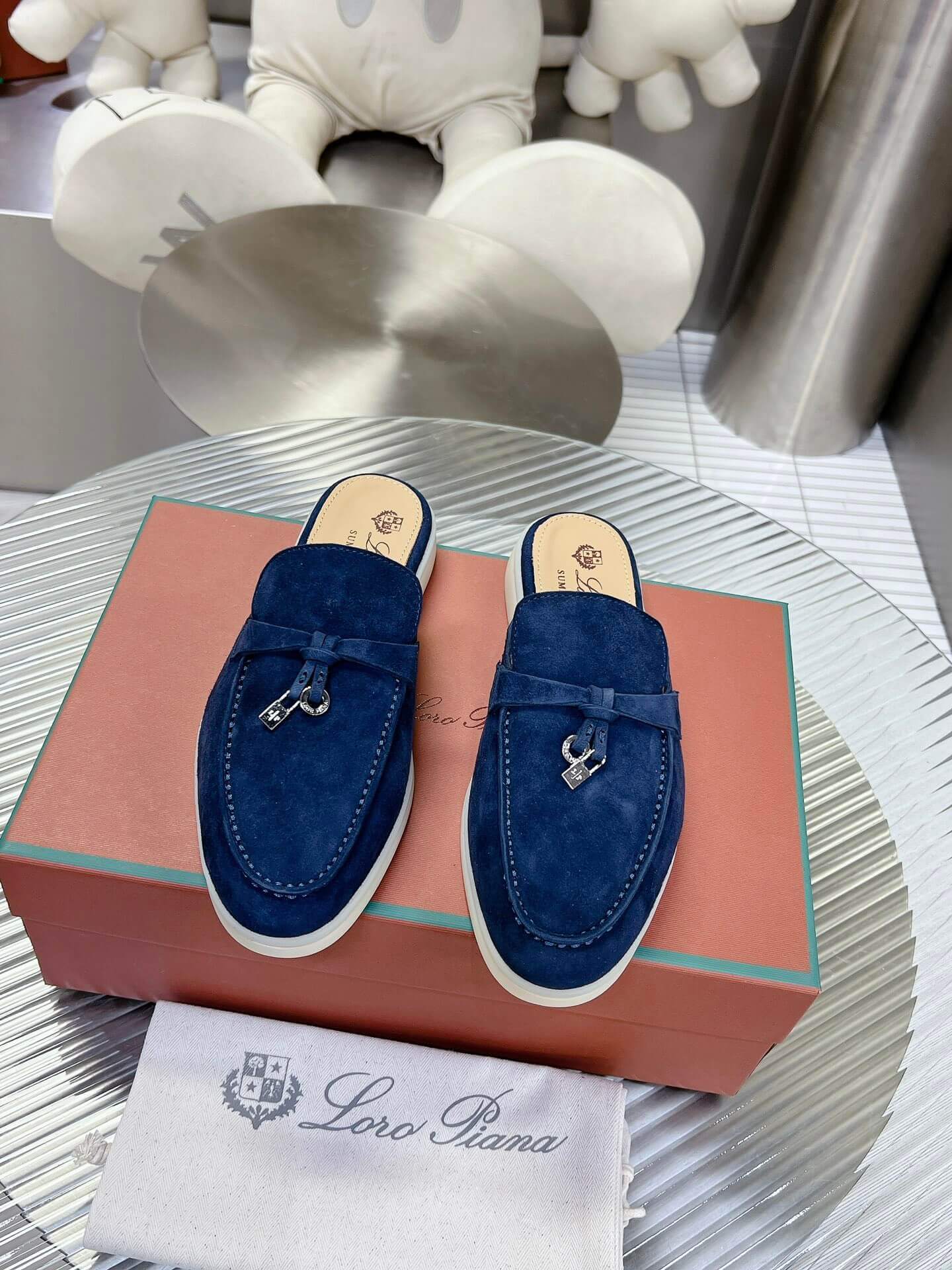 Loro Piana Men's/Unisex Babouche Charms Walk Loafers in Navy Blue Suede, displayed on a box.