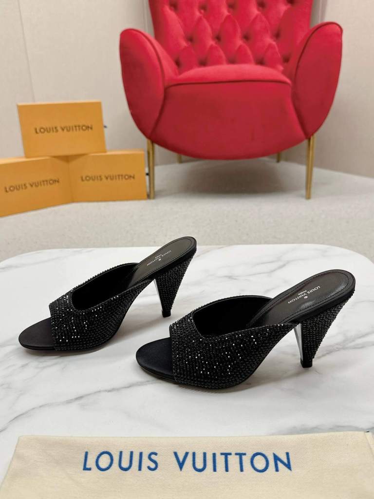 a pair of Louis Vuitton-Inspired Black Super Mule Heels on a box