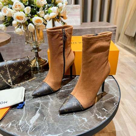 a pair of Louis Vuitton-Inspired Cherrie Ankle Boots In Tan Monogram on a table