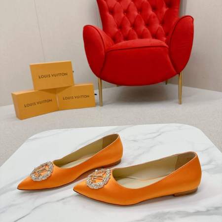 a pair of Louis Vuitton-Inspired Satin Jewel Flats – Orange on a marble table