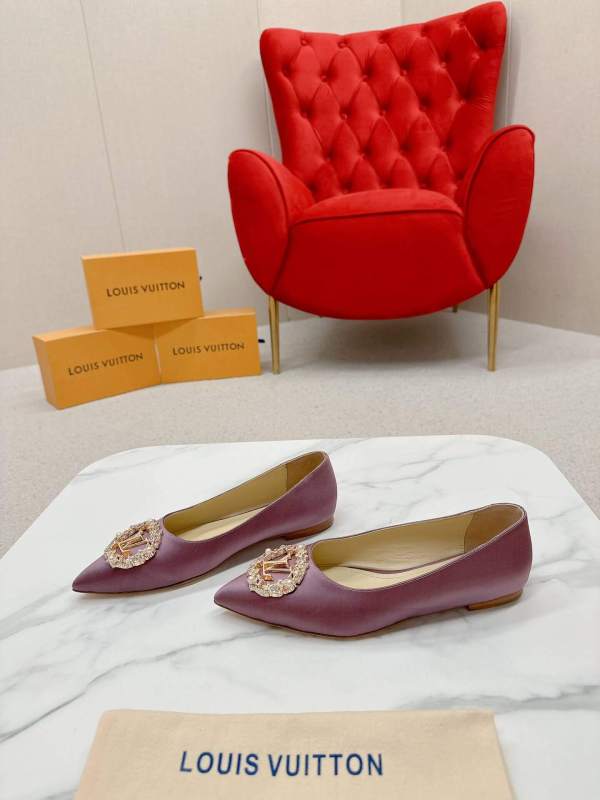 a pair of Louis Vuitton-Inspired Satin Jeweled Flats – Purple on a marble surface