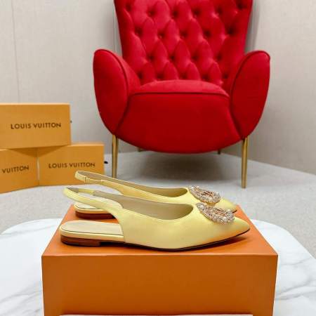 a pair of Louis Vuitton-Inspired Satin Slingback Flats – Yellow on a box
