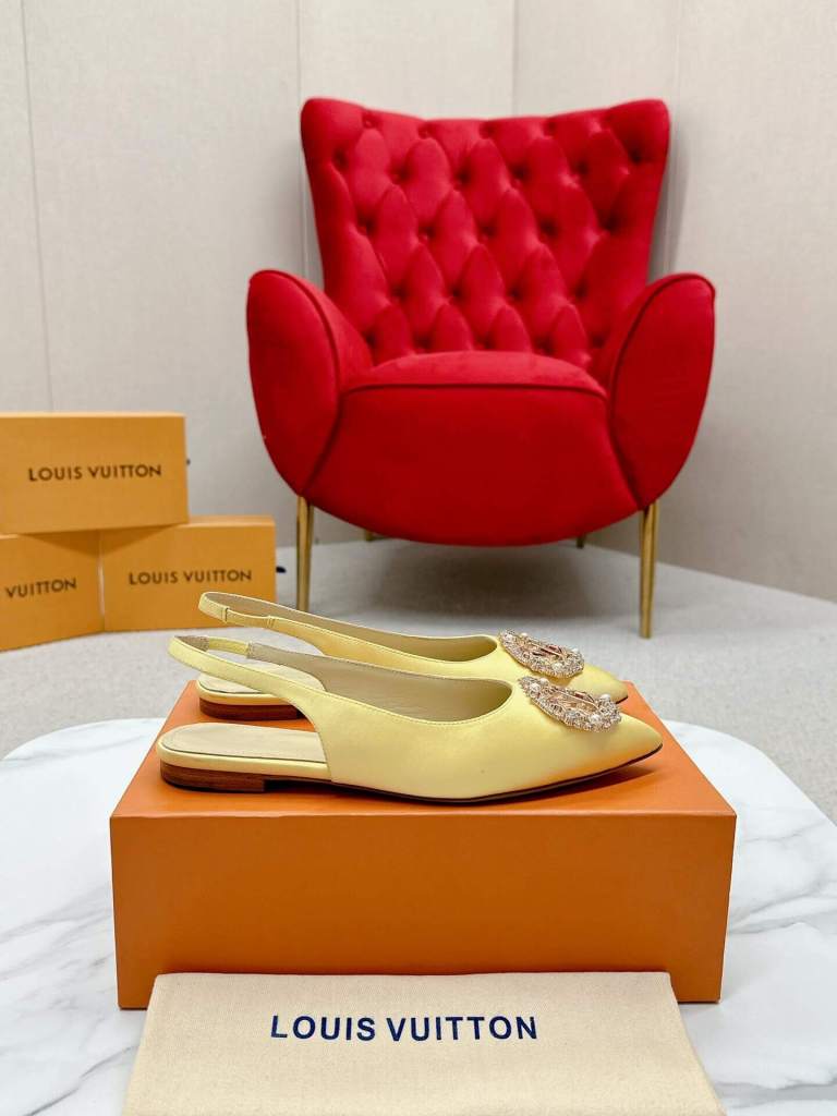 a pair of Louis Vuitton-Inspired Satin Slingback Flats – Yellow on a box