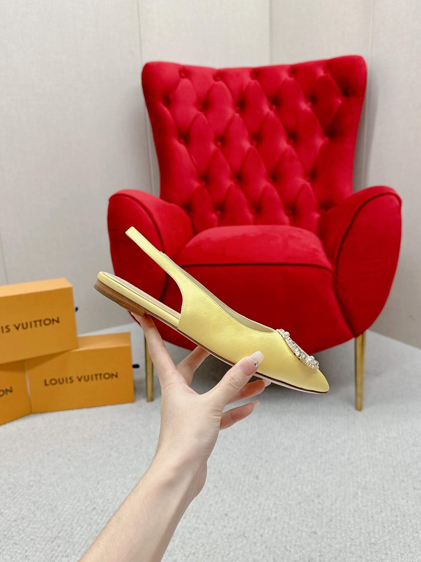 a pair of Louis Vuitton-Inspired Satin Slingback Flats – Yellow on a box