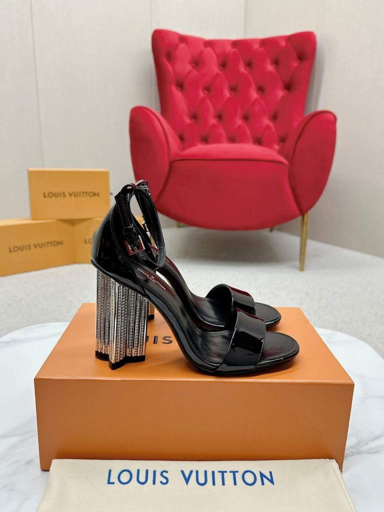 a Louis Vuitton Black Patent Leather Silhouette Sandals with Crystal‑Fringe Block Heels on a box