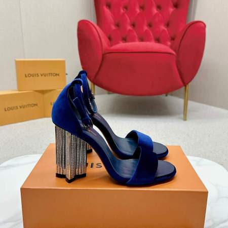 a Louis Vuitton Blue Velvet Crystal Silhouette Sandals with Crystal‑Fringe Block Heels on a box