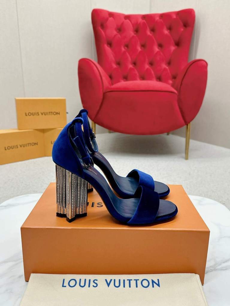 a Louis Vuitton Blue Velvet Crystal Silhouette Sandals with Crystal‑Fringe Block Heels on a box