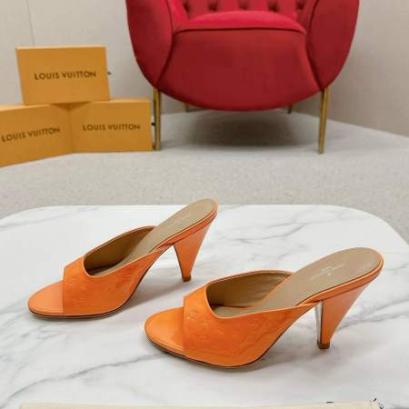 a pair of Louis Vuitton Call Back Super Mules – Glossy Orange Elegance on a box