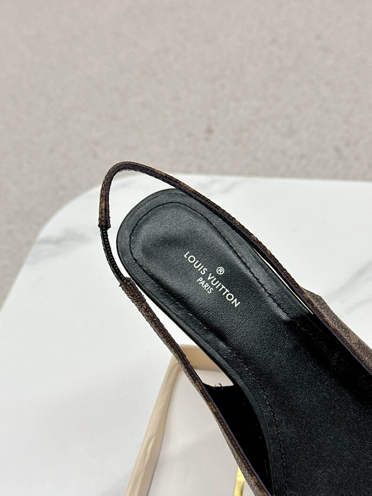 a pair of Louis Vuitton Classic Monogram Crystal Slingback Flats on a box