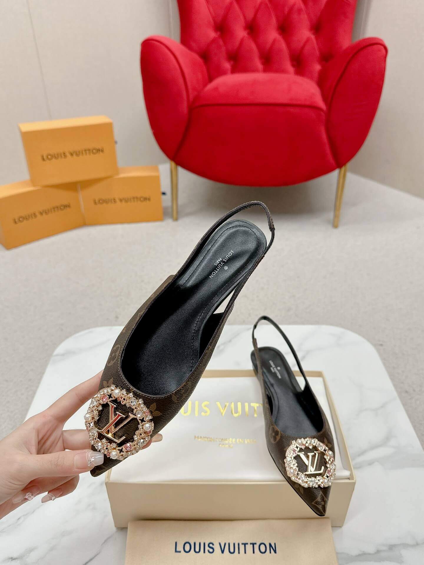 a pair of Louis Vuitton Classic Monogram Crystal Slingback Flats on a box