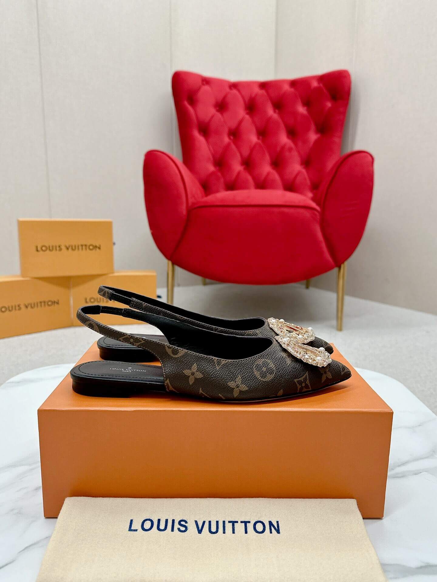 a pair of Louis Vuitton Classic Monogram Crystal Slingback Flats on a box