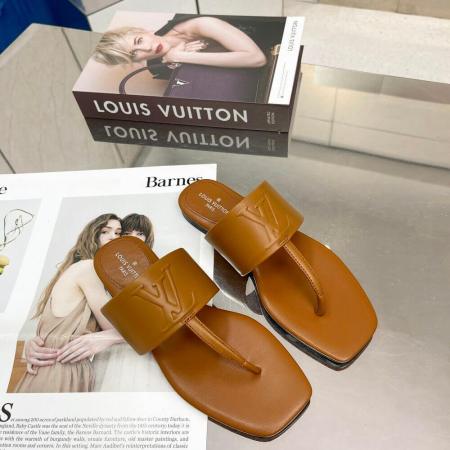 a pair of Louis Vuitton Drapy Flat Thong Sandal Brown on a table