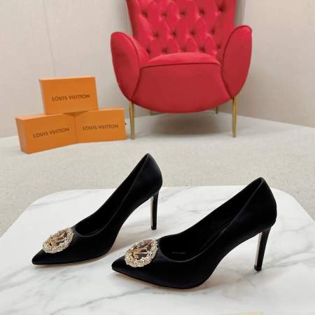 a pair of Louis Vuitton Elegant Black Satin Crystal Heels on a marble table