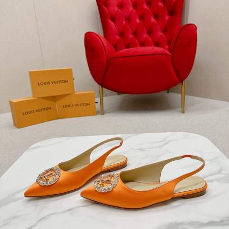 a pair of Louis Vuitton Inspired Crystal Slingback – Orange Luxe Edition on a marble table