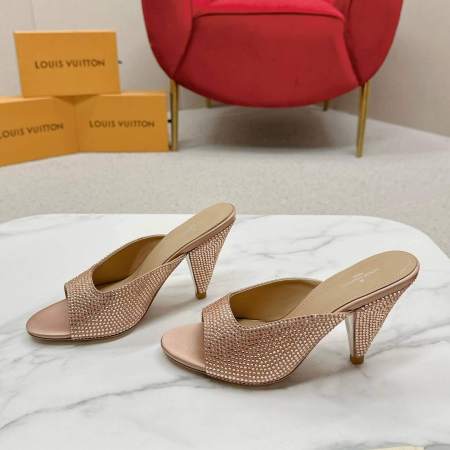 a pair of Louis Vuitton Inspired Rose Gold Super Mule Heels on a marble table